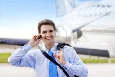 businessman-on-airport-with-a-mobile-phone